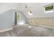 A bonus room with carpet, a built-in shelf, a ceiling fan, and natural light at 7604 Copper Creek Ct, Wake Forest, NC 27587