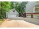 Exterior view of home showing multiple garages and an exterior staircase at 7604 Copper Creek Ct, Wake Forest, NC 27587