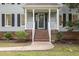 Charming home exterior with a welcoming front porch and well-maintained landscaping at 7604 Copper Creek Ct, Wake Forest, NC 27587