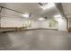 Spacious three car garage with gray floor and natural light at 7604 Copper Creek Ct, Wake Forest, NC 27587