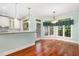 Bright breakfast nook off of kitchen with hardwood floors and natural light at 7604 Copper Creek Ct, Wake Forest, NC 27587