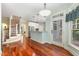 Inviting kitchen and staircase featuring hardwood floors and stainless steel appliances at 7604 Copper Creek Ct, Wake Forest, NC 27587