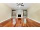 Spacious living room with fireplace, ceiling fan, and hardwood floors at 7604 Copper Creek Ct, Wake Forest, NC 27587