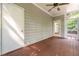 Enclosed back porch with ceiling fan and access doors at 7604 Copper Creek Ct, Wake Forest, NC 27587