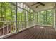 Screened in porch showing wooded back yard at 7604 Copper Creek Ct, Wake Forest, NC 27587