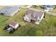 Spacious backyard featuring a storage building, lush green grass, and a charming two-story home at 80 Shallow Falls Ln, Benson, NC 27504