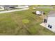 Expansive backyard featuring a well-maintained lawn, storage building, and white privacy fence at 80 Shallow Falls Ln, Benson, NC 27504
