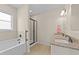 Bright bathroom with soaking tub and shower with tiled floors at 80 Shallow Falls Ln, Benson, NC 27504