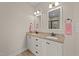 Bathroom vanity featuring granite countertop, dual sinks, and mirrors at 80 Shallow Falls Ln, Benson, NC 27504