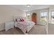 Comfortable bedroom with natural light, carpeted floors, and stylish furniture creating a cozy and inviting atmosphere at 80 Shallow Falls Ln, Benson, NC 27504
