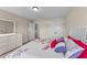 Bright bedroom featuring a plush bed, neutral walls, carpet, and ample storage creating a serene retreat at 80 Shallow Falls Ln, Benson, NC 27504
