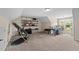 Expansive bonus room with neutral walls, carpet floors, and versatile layout offers space for work and recreation at 80 Shallow Falls Ln, Benson, NC 27504
