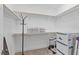 Bright, walk-in closet with white shelving, hanging racks, and carpeted floors offers generous storage solutions at 80 Shallow Falls Ln, Benson, NC 27504