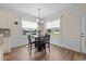 Cozy dining area featuring a dark wood table and chairs, and bright natural light at 80 Shallow Falls Ln, Benson, NC 27504