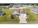 Attractive single-Gathering home featuring a two-car garage, manicured lawn, and long driveway at 80 Shallow Falls Ln, Benson, NC 27504