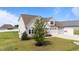 Charming home with a well-manicured lawn, a three car garage, and traditional design elements at 80 Shallow Falls Ln, Benson, NC 27504