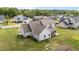 A well-maintained, two-story home featuring a screened-in porch and a backyard with lush green grass at 80 Shallow Falls Ln, Benson, NC 27504