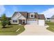 Charming single-Gathering home featuring a manicured lawn, and an attached two-car garage at 80 Shallow Falls Ln, Benson, NC 27504