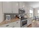 Well-equipped kitchen featuring granite countertops, stainless steel appliances, and ample cabinetry at 80 Shallow Falls Ln, Benson, NC 27504