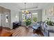 Stylish living room with large windows, coffered ceilings, and comfortable seating at 80 Shallow Falls Ln, Benson, NC 27504