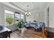 Stylish living room with large windows, coffered ceilings, and comfortable seating at 80 Shallow Falls Ln, Benson, NC 27504