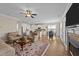 Open-concept living room flows to kitchen with hardwood floors and fireplace at 80 Shallow Falls Ln, Benson, NC 27504