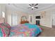 Main bedroom featuring tray ceilings, dresser, and shelving at 80 Shallow Falls Ln, Benson, NC 27504