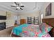 Main bedroom with ceiling fan, shelving, and dresser at 80 Shallow Falls Ln, Benson, NC 27504