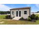 Backyard shed with double doors and a ramp, perfect for storage and hobbies at 80 Shallow Falls Ln, Benson, NC 27504