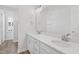 Bright bathroom featuring dual sinks with a large mirror, ample counter space and modern fixtures at 800 Hillfarm Dr, Wake Forest, NC 27587