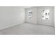 Bright bedroom with neutral carpet and walls, offering a blank canvas for personalization and comfort at 800 Hillfarm Dr, Wake Forest, NC 27587
