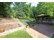 This landscaped yard includes a gazebo and staircase at 803 High Ct, Hillsborough, NC 27278