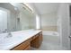 Bathroom with dual sinks and a large soaking tub at 803 High Ct, Hillsborough, NC 27278