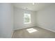 Bright bedroom with neutral carpet, window and natural light at 803 High Ct, Hillsborough, NC 27278