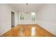 Formal dining room with traditional wainscoting and hardwood floors, perfect for Gathering gatherings at 803 High Ct, Hillsborough, NC 27278