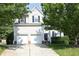 Charming two-story home featuring a two-car garage and manicured landscaping at 803 High Ct, Hillsborough, NC 27278
