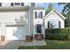 Home featuring a black front door with steps and manicured landscaping at 803 High Ct, Hillsborough, NC 27278