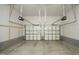 This garage features two garage doors and a concrete floor at 803 High Ct, Hillsborough, NC 27278