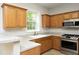 Kitchen showcasing stainless steel appliances and ample cabinet space at 803 High Ct, Hillsborough, NC 27278