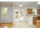 Eat-in kitchen area with lots of windows and door access to the backyard at 803 High Ct, Hillsborough, NC 27278