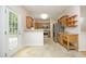 Well-lit kitchen with stainless steel appliances and light wood cabinets at 803 High Ct, Hillsborough, NC 27278