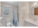 Cozy bathroom with shower, toilet, sink, and ample natural light at 804 Colonial Dr, Raleigh, NC 27603