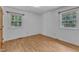 Bedroom with hardwood floors, and ample natural light through bright windows at 804 Colonial Dr, Raleigh, NC 27603