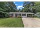 Charming single-story home with brick and white siding, and an inviting carport at 804 Colonial Dr, Raleigh, NC 27603