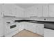 The kitchen features white cabinets and ample counter space at 804 Colonial Dr, Raleigh, NC 27603