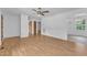 Bright living room featuring hardwood floors and a large window for natural light at 804 Colonial Dr, Raleigh, NC 27603