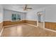 Spacious living room with wood-paneled walls and bright natural light at 804 Colonial Dr, Raleigh, NC 27603