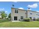 Exterior view of home with two patios, lush backyard, and a well-maintained lawn at 8111 Yaxley Hall Dr, Raleigh, NC 27616