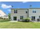 Home exterior showcasing a lush lawn, patios, and siding at 8111 Yaxley Hall Dr, Raleigh, NC 27616