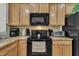 Well-equipped kitchen showcasing granite countertops, stainless appliances, and ample cabinet space at 8111 Yaxley Hall Dr, Raleigh, NC 27616